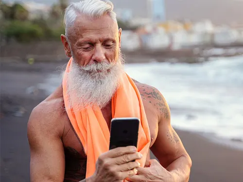 Man completing an online TRT health assessment on his phone